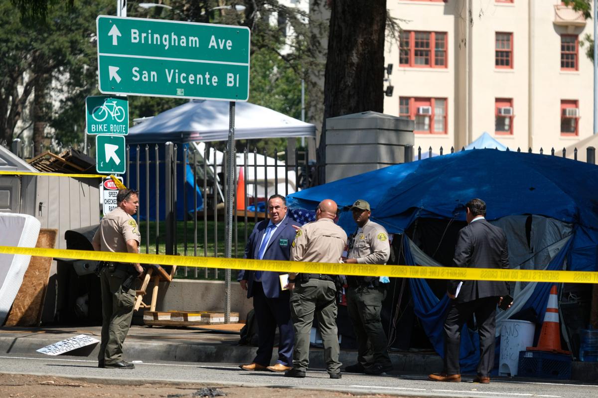 Police tape surrounds a homeless encampment outside the West LA VA.