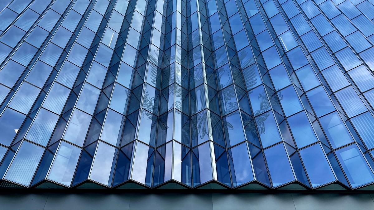 Detail of windows with United States eagle crest on the First Street Federal Courthouse building, Downtown Los Angeles.